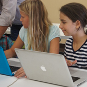 Ignite Creative Learning classroom photograph 5 of 8 showing students and an instructor working at computers.