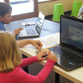 Ignite Creative Learning classroom photograph 6 of 8 showing students and an instructor working at computers.
